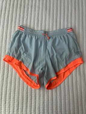New Balance Light Blue Mesh Running Shorts with Orange Eyelets